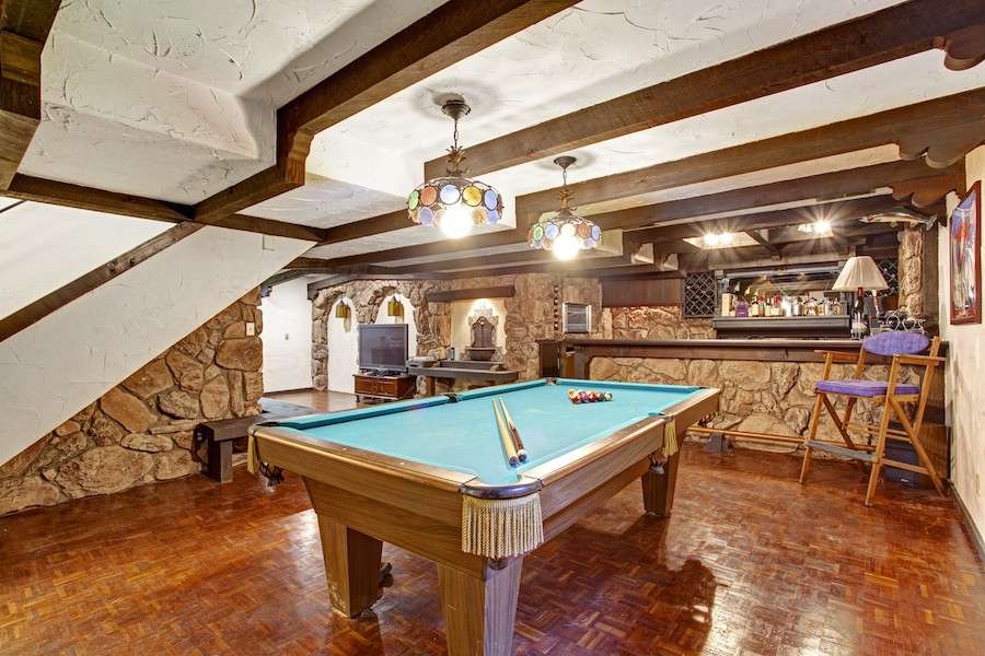 Accent lighting in a rec room with a pool table.