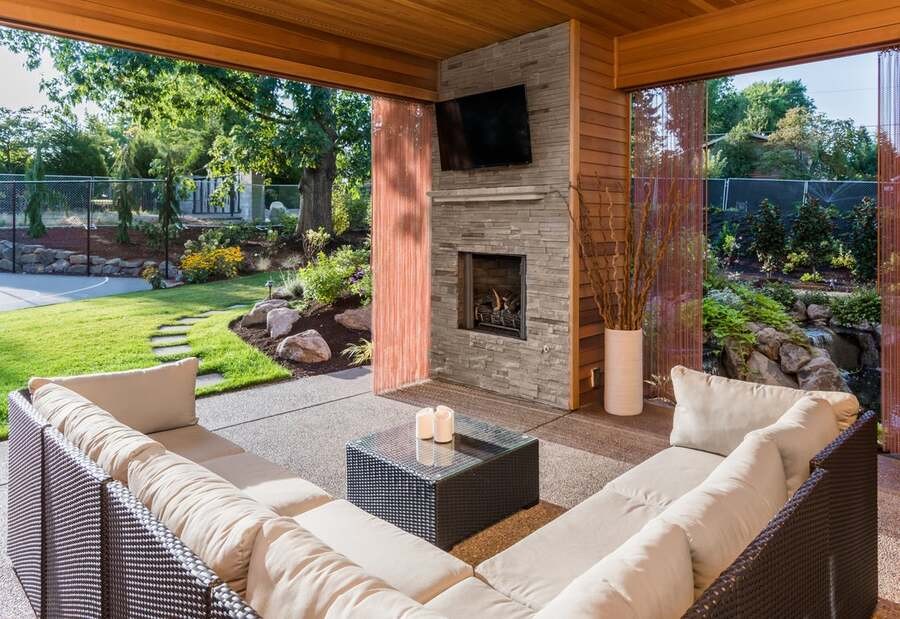 An elegant roofed alfresco space and outdoor TV