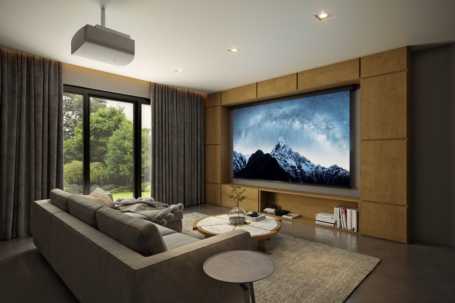 A cozy home theater in a contemporary Metairie home with couch seating, a ceiling-mounted projector, and a large screen.