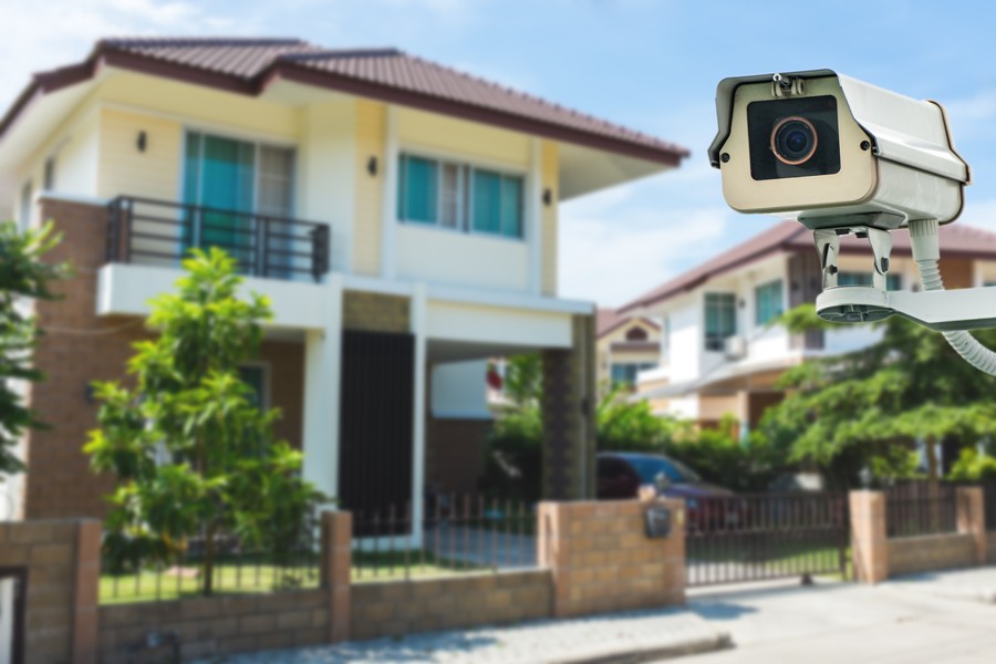A surveillance system overseeing a luxury home.